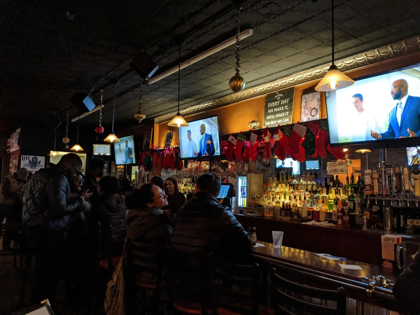 Duke's bar counter packed with patrons